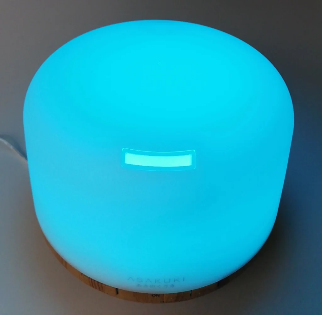 asakuki diffuser glowing cyan in a darkened room showing led light mode