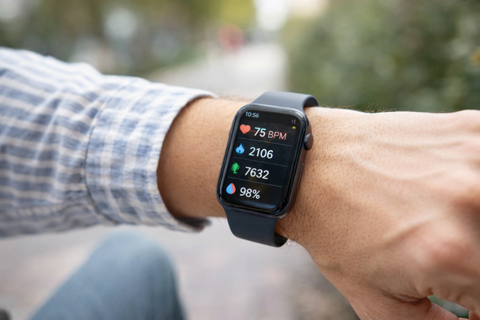 smartwatch displaying health metrics including heart rate, steps and blood oxygen levels