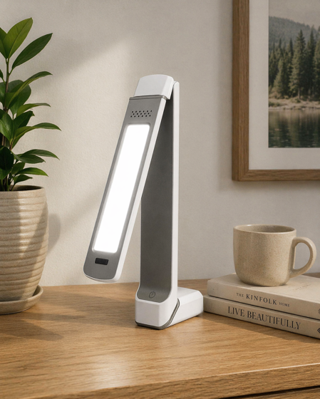 circadian optics lumos 2.0 folding light therapy lamp on a wooden surface