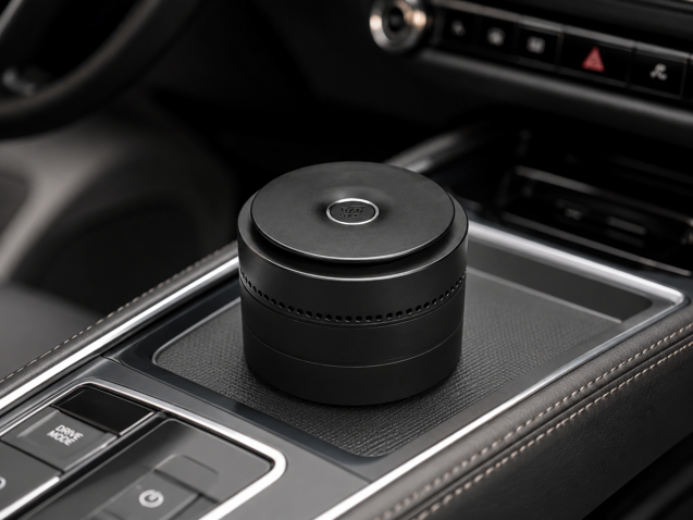 pura car fragrance diffuser on car center console